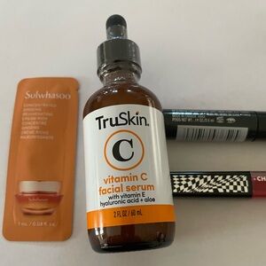 Four pc makeup skin care set. TruSkin Vit C Serum, gloss, Clinique, Sulwhasoo.